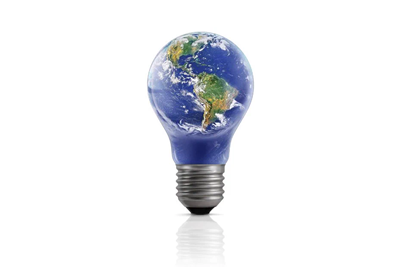 Light bulb with Earth image inside the glass, showing North and South America, symbolizing environmental awareness and sustainable energy solutions.